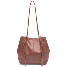 Brown leather tote bag with drawstring on a white background