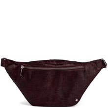 Brown suede waist bag with a silver zipper on a white background