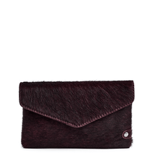 Dark brown fur clutch bag on a white background