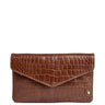 A brown faux-crocodile leather clutch wallet with an envelope-style flap and a small gold button closure, shown on a plain white background.