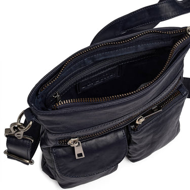navy leather bag with multiple zippers on a white background