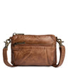 A brown distressed leather crossbody bag with a top zipper, a front zippered pocket, and a matching leather strap with brass-tone hardware, shown on a plain white background.