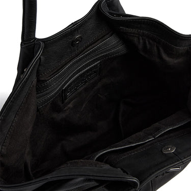 Close-up of a black leather bag with visible stitching details.