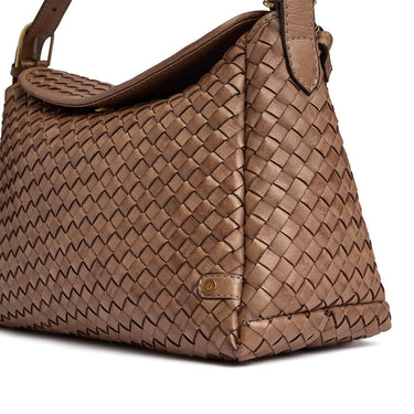 Brown woven handbag on a white background