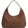 Brown woven handbag on a white background