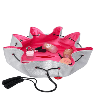 Makeup organizer with pink interior and gray exterior, containing makeup items on a white background.
