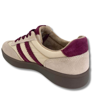 A low-top sneaker shown from a three-quarters rear angle, featuring a cream suede and textile upper with three burgundy stripes, a burgundy heel tab, matching burgundy laces, and a thick dark brown sole.