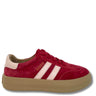 A low-top suede sneaker in deep red with three light pink stripes, a beige heel tab, and a thick tan platform sole, shown against a plain white background.