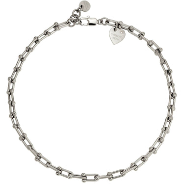 A silver-toned chain bracelet with alternating elongated oval links and smaller bead links, featuring a lobster clasp and a heart-shaped tag engraved with 'CHRISTIAN DIAMOND DESIGN'.