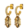 Gold hoop earrings with large amber gemstones on a white background
