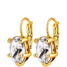 A pair of gold leverback earrings with large, clear oval-cut crystals in a prong setting, shown against a plain white background.