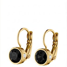 Gold hoop earrings with black gemstones on a white background