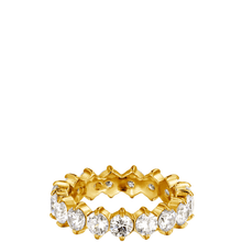 Gold ring with clear gemstones on a white background