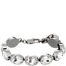 A silver-toned link bracelet featuring oval clear faceted rhinestones, shown against a plain white background.