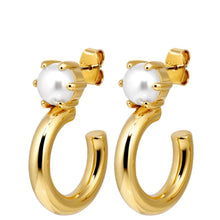 Gold hoop earrings with pearl centers on a white background