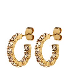 Gold hoop earrings with embedded crystals on a white background