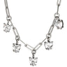 Silver necklace with heart-shaped diamond pendants on a white background