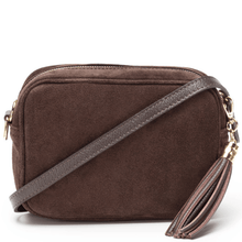 A dark brown suede crossbody bag with a matching brown leather strap and gold-tone hardware, shown on a clean white background.