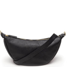 Black pebbled leather crescent-shaped crossbody bag with a gold zipper and a matching leather strap, shown on a plain white background.