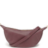 wine toned leather handbag with a gold zipper on a white background
