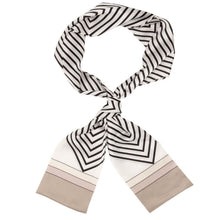 A lightweight scarf with a black and white geometric pattern, featuring chevron and stripe designs and solid beige ends, displayed on a clean white background.