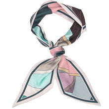 A square silk scarf with a geometric color-block pattern, styled in a knot on a solid white background.