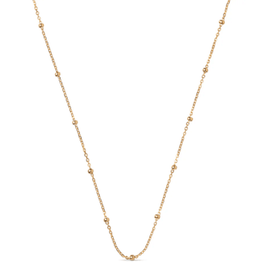Gold chain necklace on a white background