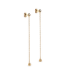 Gold chain earrings on a white background