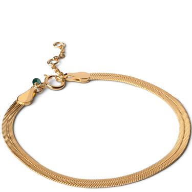 Gold bracelet with a green bead on a white background