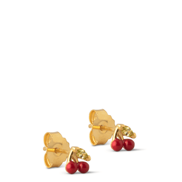 Gold earrings with red stones on a white background