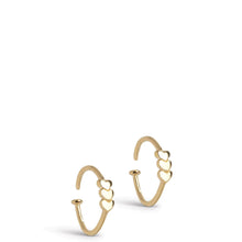 Gold hoop earrings with heart designs on a white background