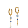 Gold hoop earrings with blue and white bead charms on a white background