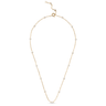 Gold necklace with small beads on a white background