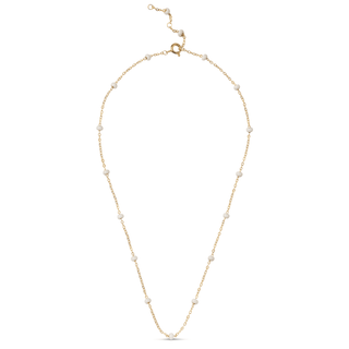 Gold necklace with small beads on a white background