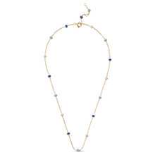 Gold necklace with blue and white beads on a white background