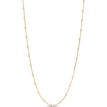 Gold necklace with small beads on a white background