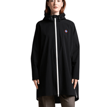 Person wearing a black raincoat with a white zipper on a white background