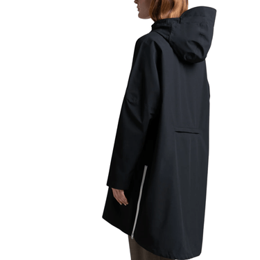 Black raincoat worn by a person on a white background