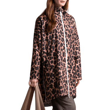 Person wearing a leopard print raincoat with a visible brand logo on a white background