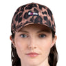 A woman wearing a leopard-print baseball cap with a small 'flo-lette.' logo patch on the front, shown against a plain white background.