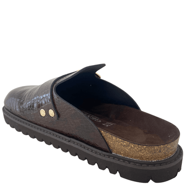Brown slip-on shoe with cork insole on a white background