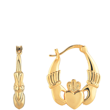 Gold claddagh hoop earrings on a white background