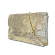 Gold clutch bag with a gold chain on a white background