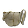 Gold crossbody bag on a white background
