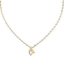 A gold chain necklace featuring a small heart-shaped pendant with a clear faceted gemstone and a tiny gold accent, displayed against a solid white background.