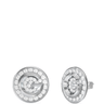 Silver earrings with clear gemstones on a white background