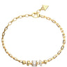 A gold chain bracelet with a lobster clasp, featuring a small triangular charm engraved with 'GRANDE' and a central cluster of clear baguette and round crystals, displayed on a solid white background.