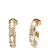 A pair of gold huggie hoop earrings with baguette-cut clear gemstones, shown on a plain white background.