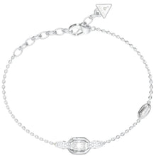 A silver chain bracelet with a central geometric setting holding a clear baguette-cut gemstone, flanked by small clear stones, on a plain white background.