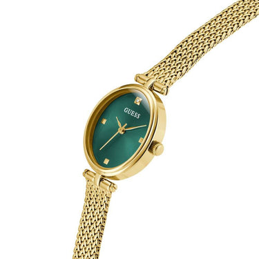 Gold watch with a green face on a white background